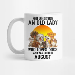 Never Underestimate An Old August Lady Who Loves Dogs Mug